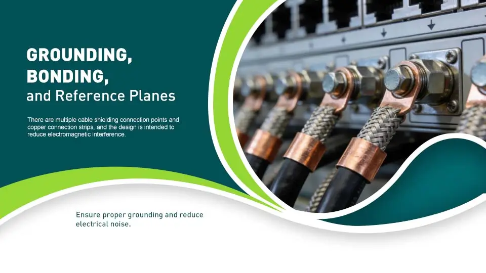 The image shows a close-up view of an industrial control panel's grounding bar, featuring multiple cable shield connections and copper bonding straps designed to reduce electromagnetic interference (EMI). This setup is crucial for maintaining the reliability and performance of the elevator control system by ensuring proper grounding and minimizing electrical noise.